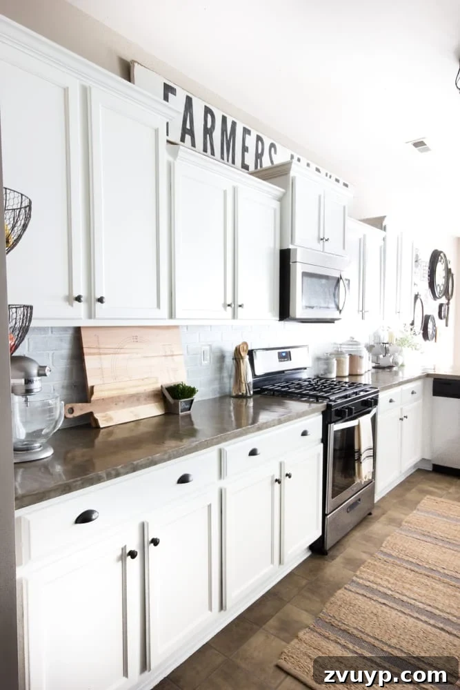 Our Stunning Modern Farmhouse Kitchen Transformation 10 The kitchen's updated view, showcasing the impact of the striped jute rug on the existing vinyl flooring, adding warmth and style.