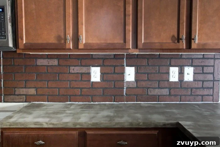 Rustic Chic Whitewashed Faux Brick Backsplash DIY 12 caulking brick panel seams for a seamless faux brick backsplash