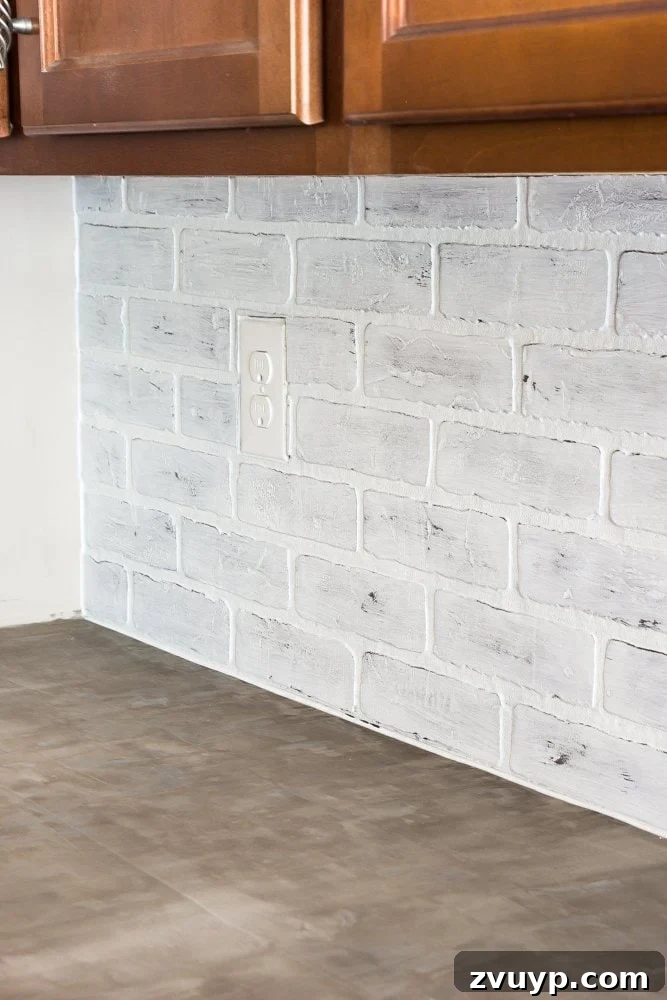 Rustic Chic Whitewashed Faux Brick Backsplash DIY 16 sealed whitewashed faux brick backsplash in a kitchen