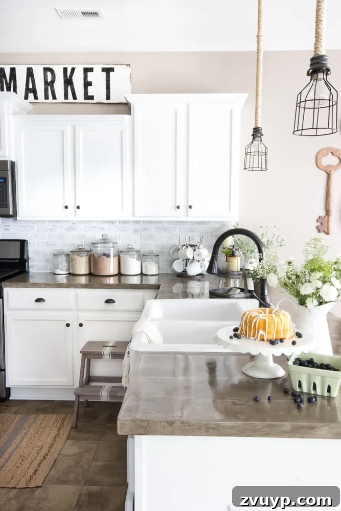 Rustic Chic Whitewashed Faux Brick Backsplash DIY 18 modern farmhouse kitchen with faux brick backsplash, concrete countertops, and white cabinets - final reveal