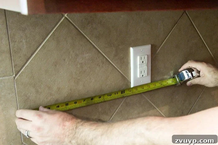 Rustic Chic Whitewashed Faux Brick Backsplash DIY 8 measuring a backsplash for outlets before cutting faux brick panels