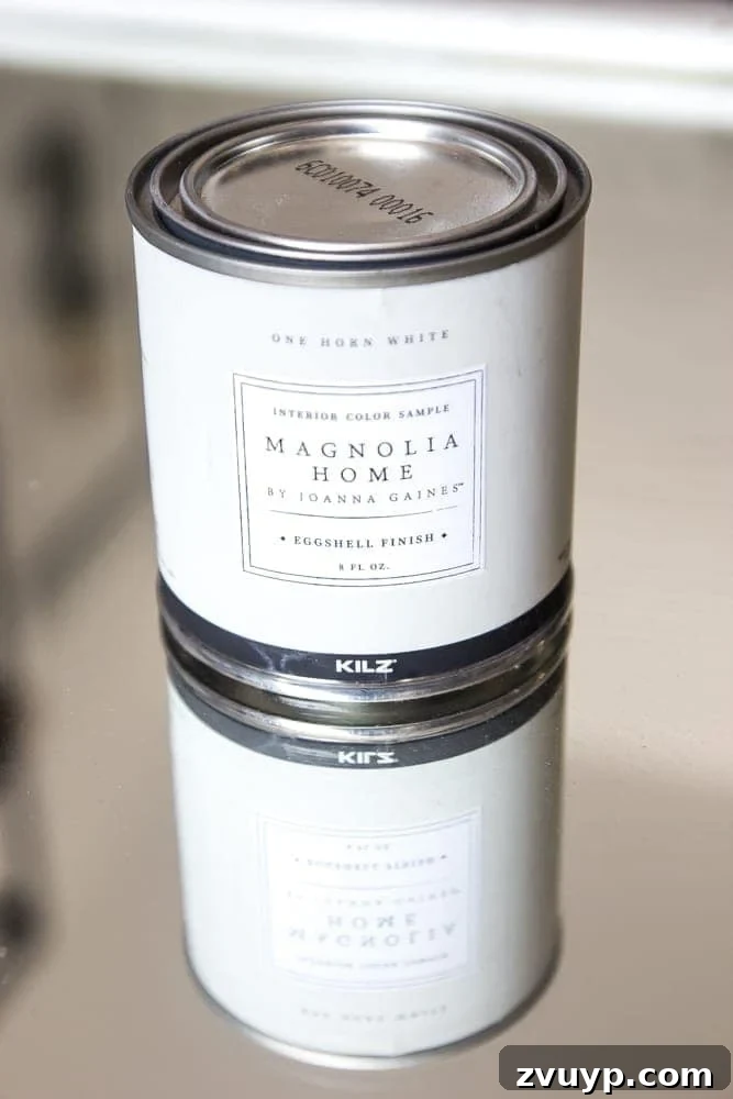 Mirror Frames Reborn as Photo Displays 5 Applying Joanna Gaines' Magnolia Home Paint in One Horn White to a repurposed mirror frame