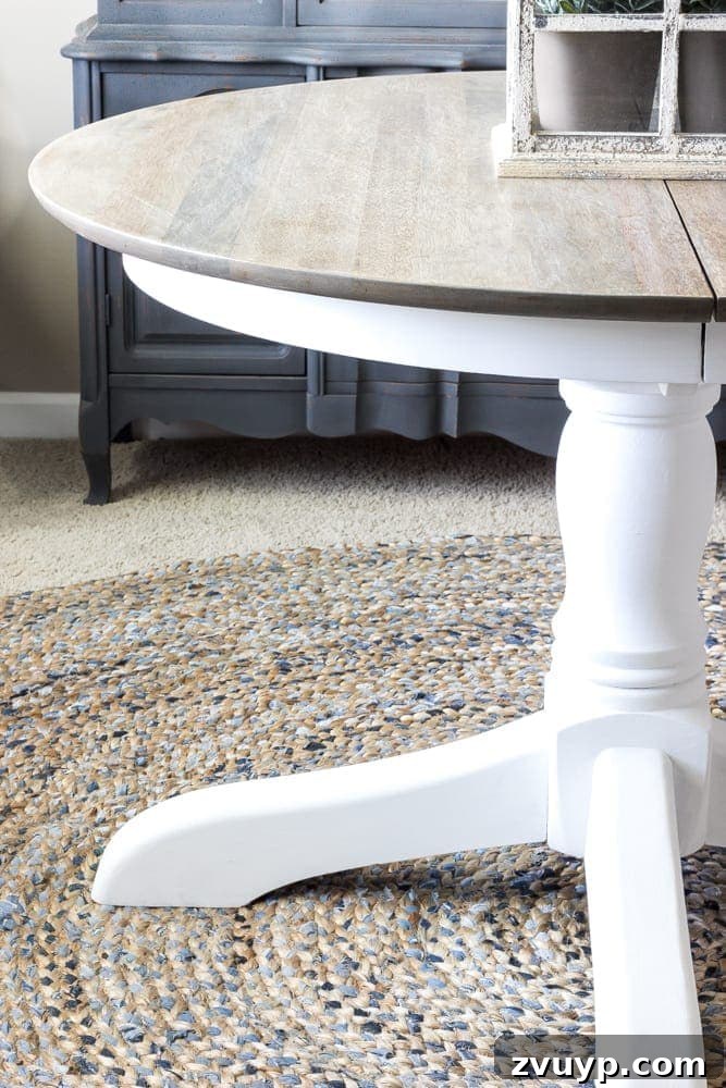 Weathered Oak's Elegant Rebirth 9 Finished weathered oak dining table with a crisp white painted base