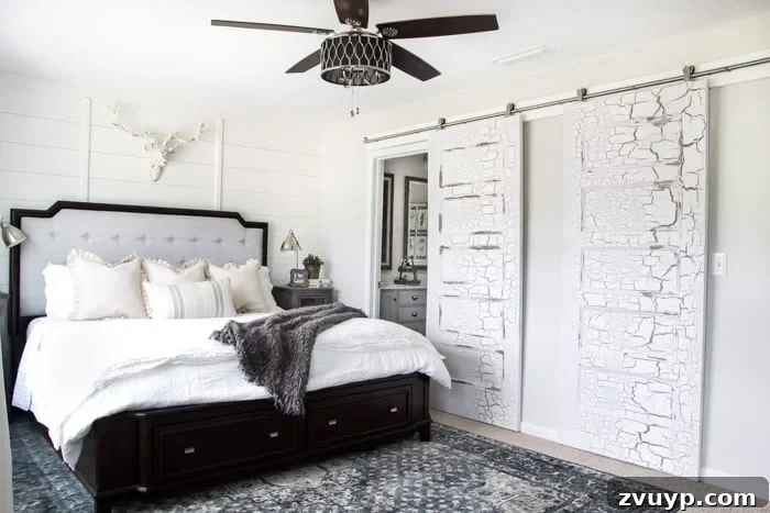 DIY Sliding Barn Door Installation Guide 12 The master bedroom with beautifully installed sliding barn doors, transforming the space.
