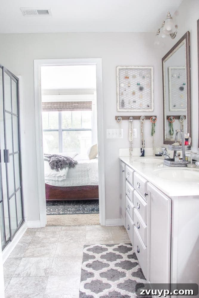 DIY Sliding Barn Door Installation Guide 15 Bathroom entrance with new sliding barn door, improving flow and preventing door collisions.
