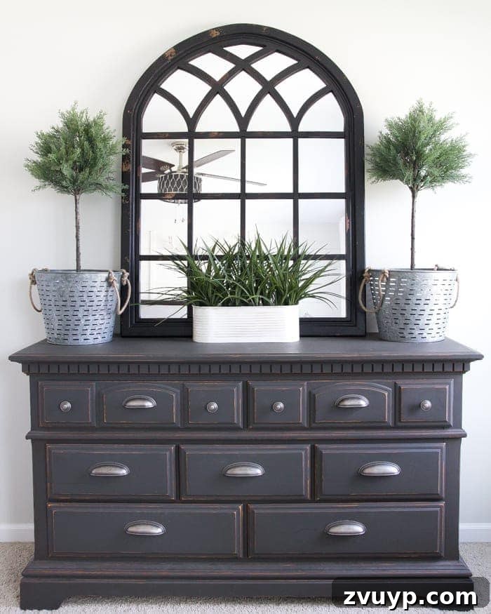 Unveiling Our Rustic Modern Sanctuary: Master Bedroom Decor & Shopping Guide 11 Refreshed dresser in the rustic modern master bedroom with new hardware, mirror, and topiaries