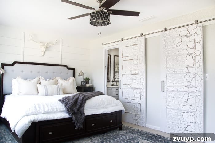 Unveiling Our Rustic Modern Sanctuary: Master Bedroom Decor & Shopping Guide 6 After: Beautiful distressed sliding barn doors adding rustic charm and functionality