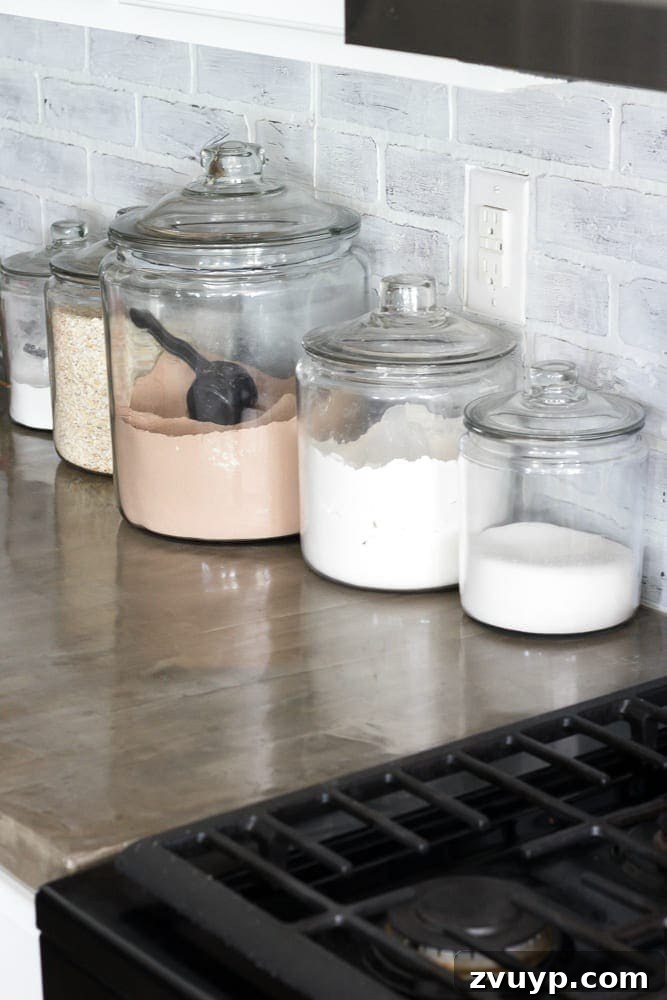 Concrete countertop with visible grease stains near stove