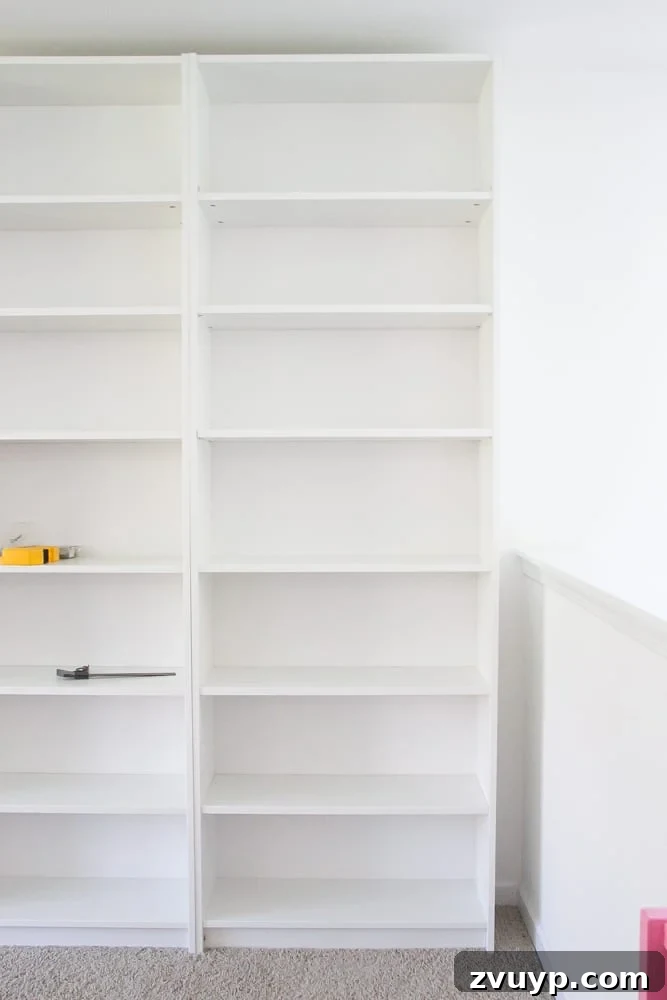 IKEA Bookcase to Seamless Built-In Shelving 11 IKEA billy bookcases just assembled