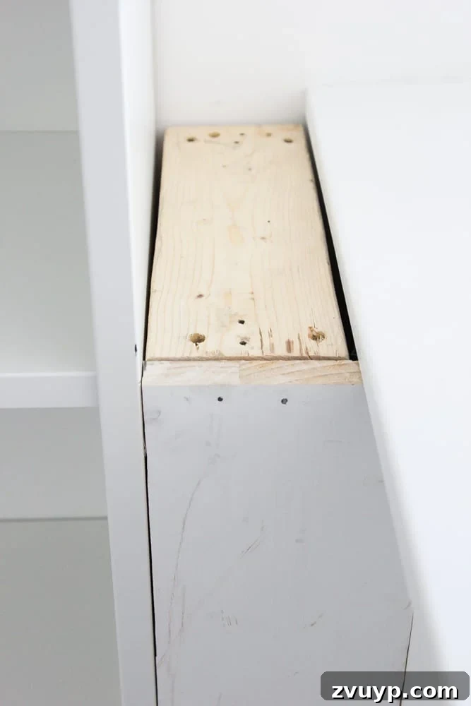 building a box to fill a gap between a bookcase and a half way to make built ins