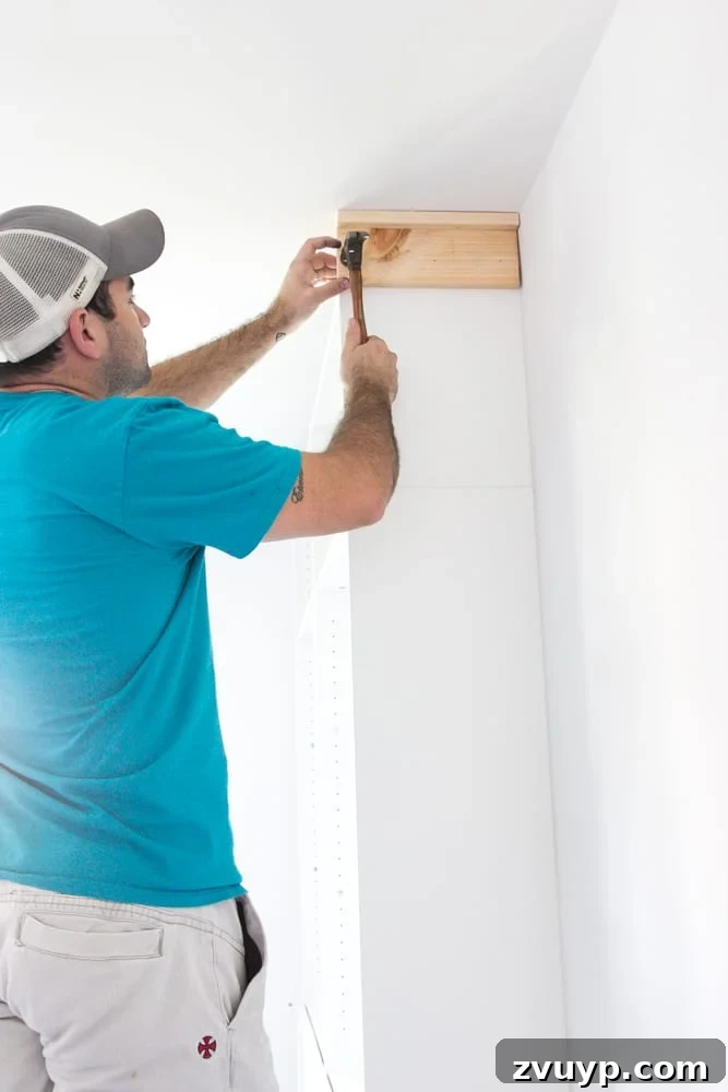 Adding a header to bookcase to fill gap at ceiling