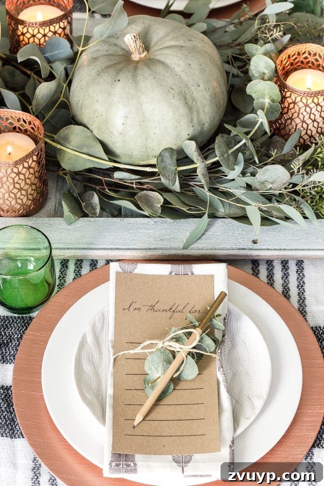 Green Copper Thanksgiving Table Inspiration and Printables 5 Place setting with white plates, cable knit plates, and copper charger