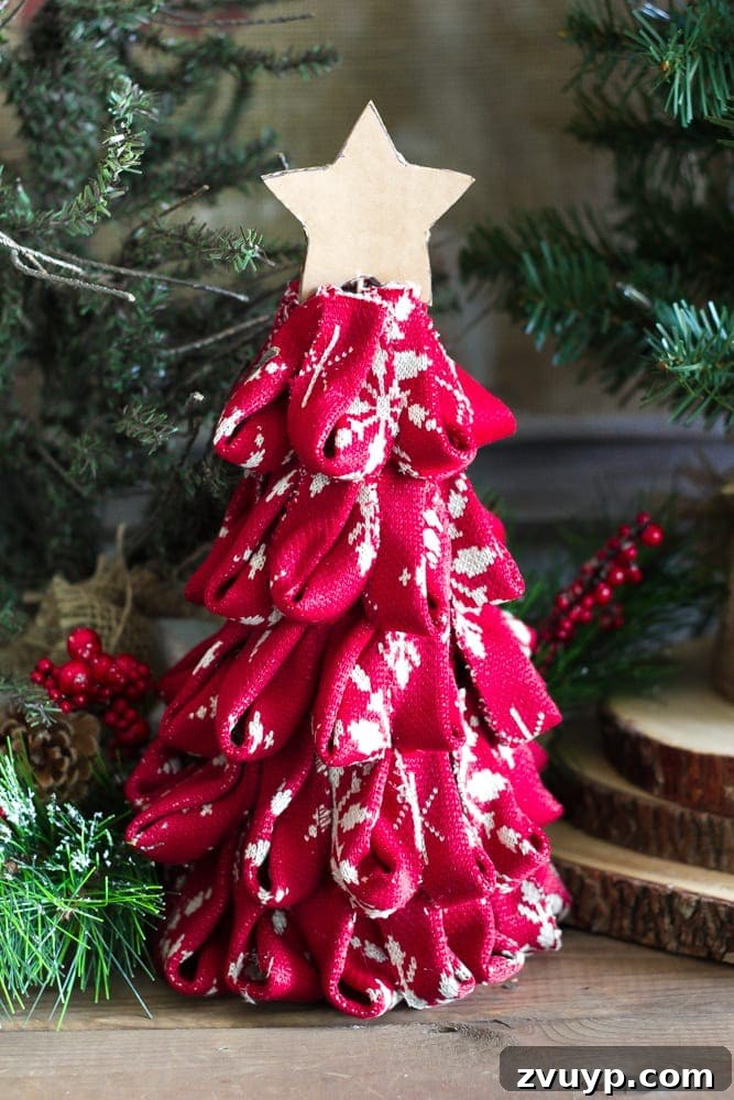 Cozy Knit Mini Christmas Trees 13 DIY Nordic Sweater Mini Christmas Trees | blesserhouse.com - How to make Nordic sweater mini Christmas trees using just florist foam, ribbon, and hot glue for cute decor accents on tabletops and mantels.