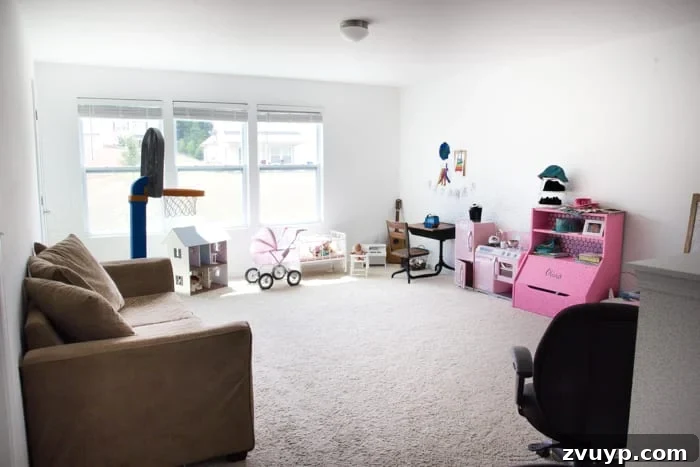 One Room Challenge Week 6 Our Eclectic Farmhouse Playroom Is Here 2 Before Eclectic Farmhouse Playroom Makeover - A cluttered and uninspired playroom before its transformation.