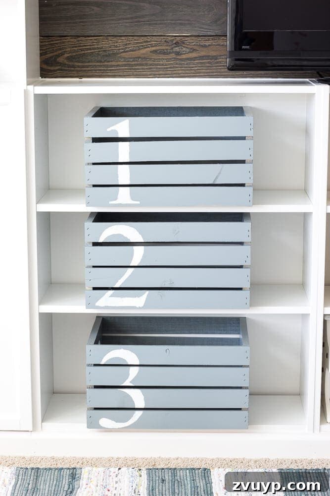 One Room Challenge Week 6 Our Eclectic Farmhouse Playroom Is Here 11 DIY numbered wooden crates for toy storage - budget-friendly playroom organization.