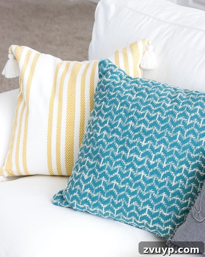 One Room Challenge Week 6 Our Eclectic Farmhouse Playroom Is Here 32 Playroom details - pillows and decor.