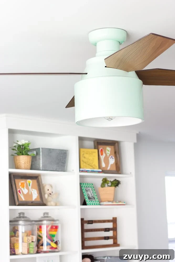 One Room Challenge Week 6 Our Eclectic Farmhouse Playroom Is Here 35 Mint ceiling fan from Hunter Fan - a stylish playroom lighting choice.