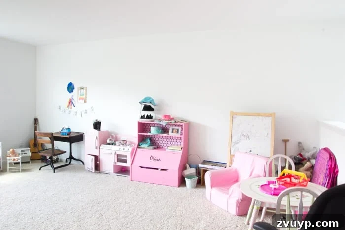 One Room Challenge Week 6 Our Eclectic Farmhouse Playroom Is Here 8 Playroom before makeover - another angle showing disarray.