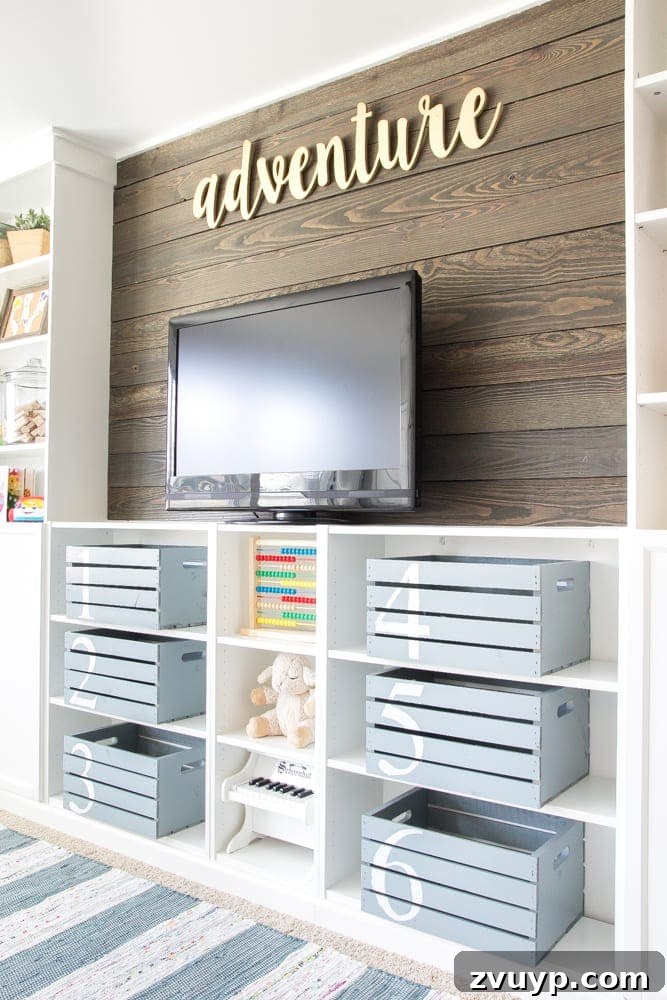 One Room Challenge Week 6 Our Eclectic Farmhouse Playroom Is Here 10 DIY wood plank accent wall in playroom - a key farmhouse design element.