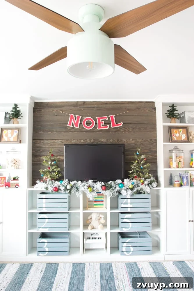 Three Years, One Home: The Transformation Tour 19 Playroom after makeover: a vibrant, eclectic farmhouse space with built-in storage, work desks, and a cozy area, decorated for Christmas.