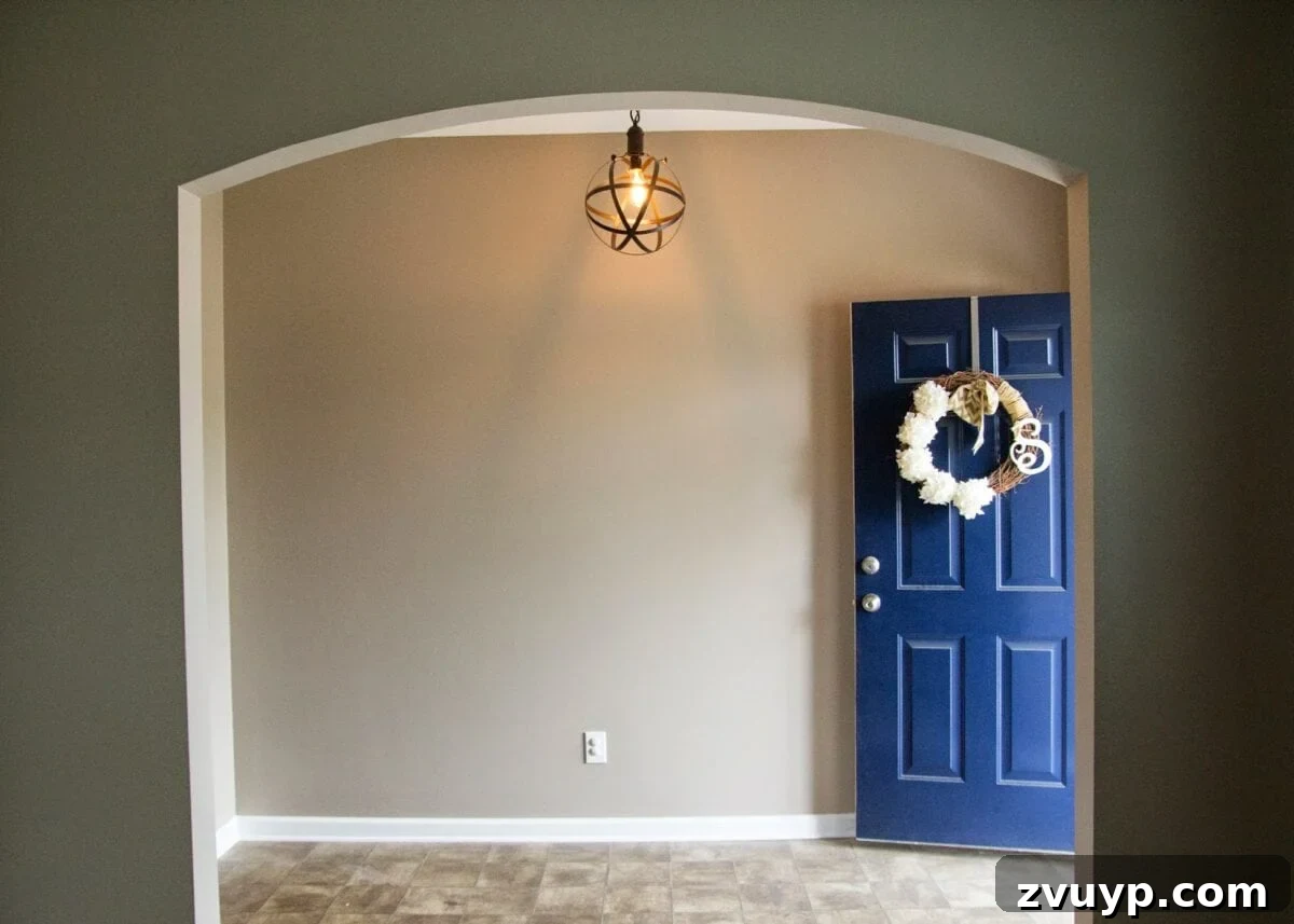 Three Years, One Home: The Transformation Tour 3 Foyer before makeover: a plain, empty space in a suburban tract house awaiting budget-friendly DIY transformation.
