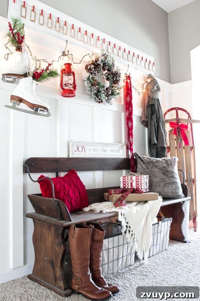 Three Years, One Home: The Transformation Tour 6 Hallway after makeover: functional and stylish with a DIY board and batten wall and a Craigslist bench, decorated for Christmas.