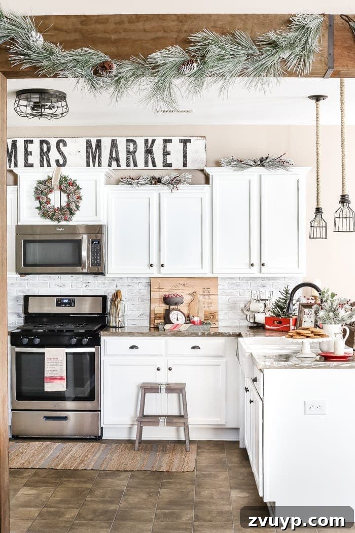 Three Years, One Home: The Transformation Tour 10 Kitchen after makeover: bright and airy with white cabinets, transformed into a modern farmhouse culinary space, decorated for Christmas.