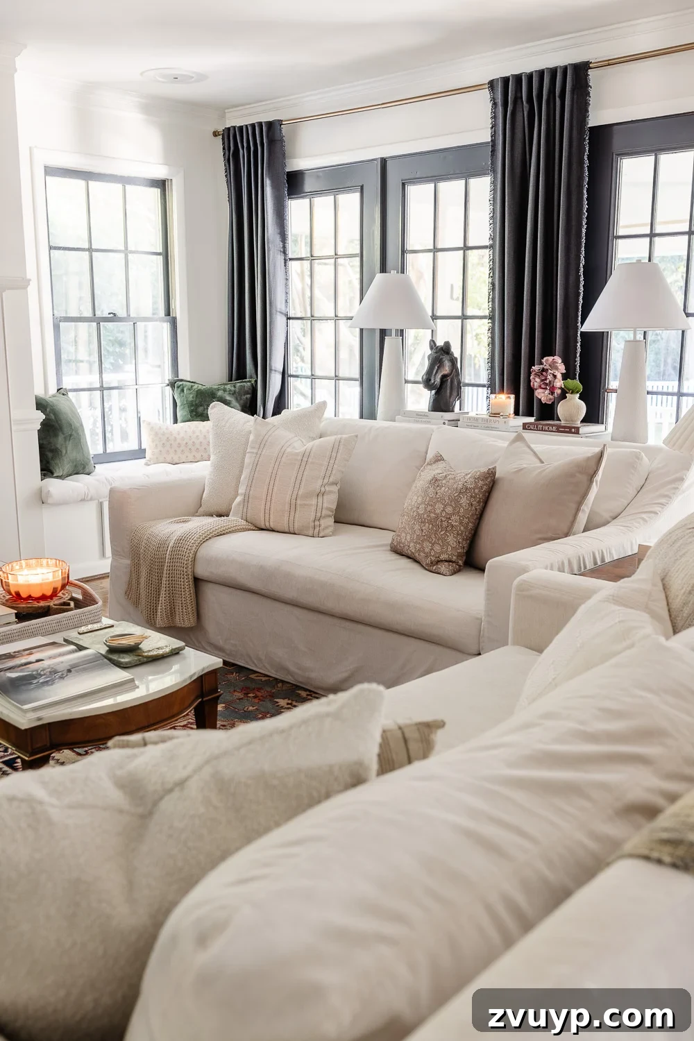 The Complete Home Deep Clean Blueprint 3 A beautifully organized and clean living room, showcasing a tidy sofa with plump cushions, neatly arranged decorative items on a sofa table, and a general ambiance of peaceful order.
