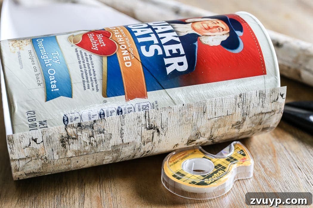 Crafting a Natural Birch Bark Vase 5 DIY Birch Bark Vase from an Oatmeal Can | blesserhouse.com - A quick tutorial for how to make a DIY birch bark vase for cheap using items from your pantry to create a cozy style for displaying faux florals.