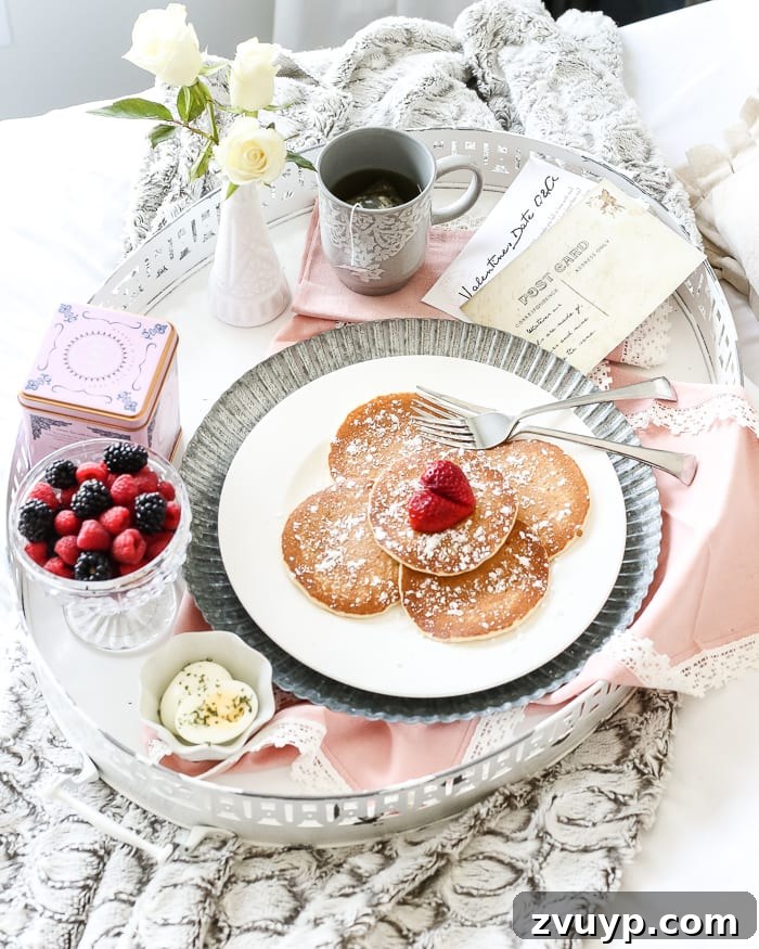 Beautifully transformed shabby chic enamel breakfast tray with distressed edges, ready for a romantic Valentine's Day setup.