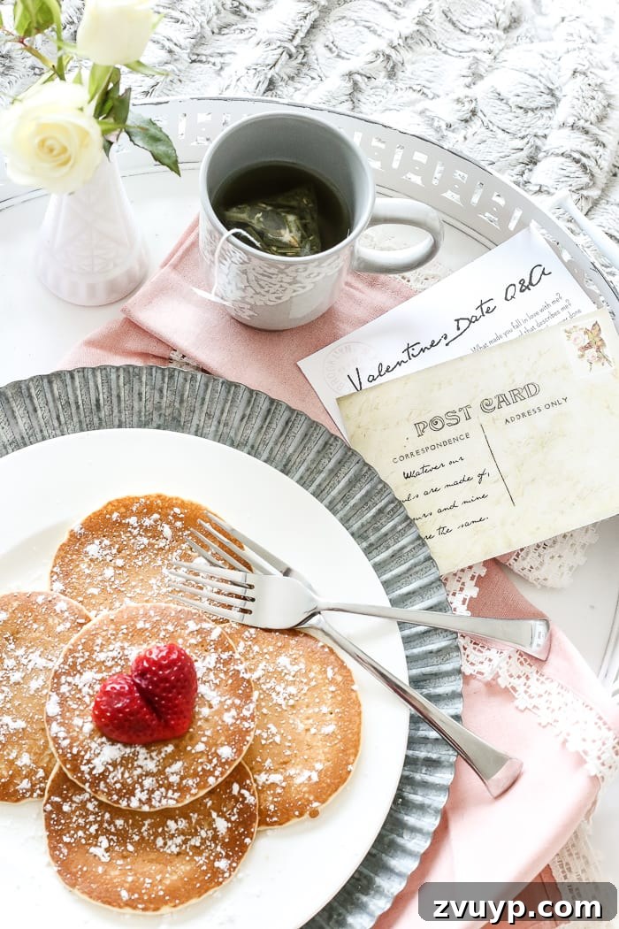 Stylized photo of the DIY shabby chic breakfast tray set with a romantic Valentine's Day theme, featuring a Q&A postcard.