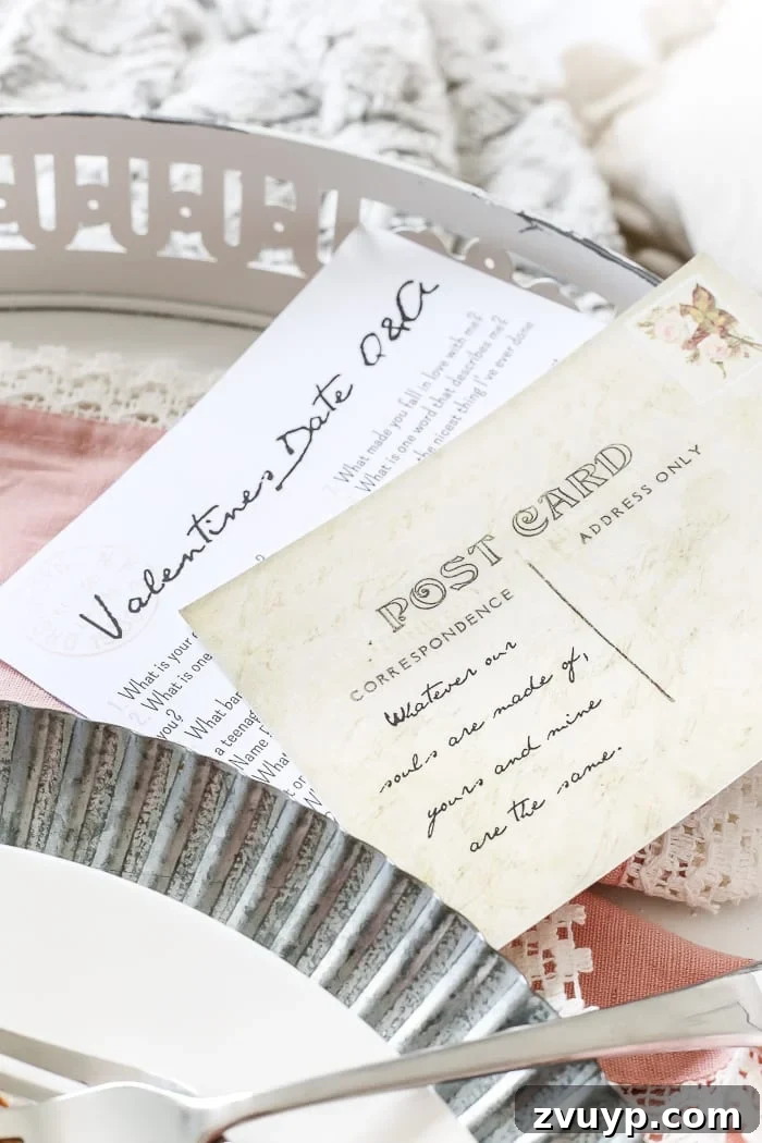 Antique-style printable Valentine's Date Q&A postcards placed on a romantic breakfast tray setup.