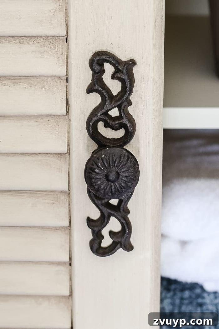 Distressed Shutter Armoire Transformation 3 Detail shot of the aged finish on the faux antique shutter armoire, highlighting the Espresso wax application on the Fusion Mineral Paint Plaster.