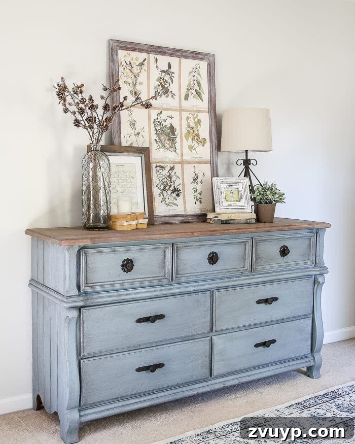 Azure Dream: My Dresser's French Blue Revival 14 French Blue Dresser Makeover | A corner view of the styled French blue dresser, enhancing the guest bedroom ambiance.