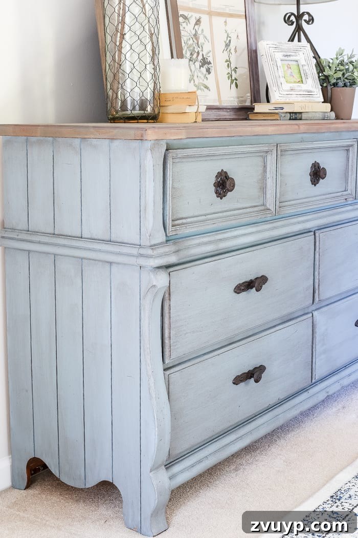 Azure Dream: My Dresser's French Blue Revival 10 French Blue Dresser Makeover | Detailed view of the planked sides on the French blue dresser, enhanced by paint and wax.