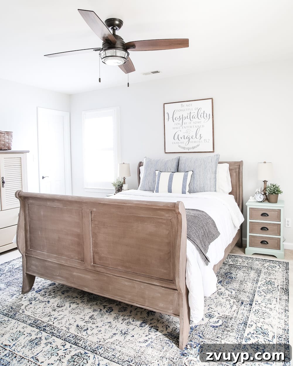 From Weathered to Wonderful A Painted Bed Revival 14 Guest bedroom window with plantation shutters; debating whether to add curtains to complete the room's aesthetic.