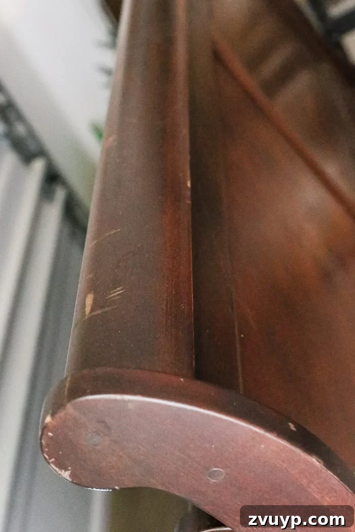 From Weathered to Wonderful A Painted Bed Revival 3 Close-up of the Weathered Wood Painted Sleigh Bed. Achieve a rustic, vintage look on a thrifted bed with this simple painting technique.