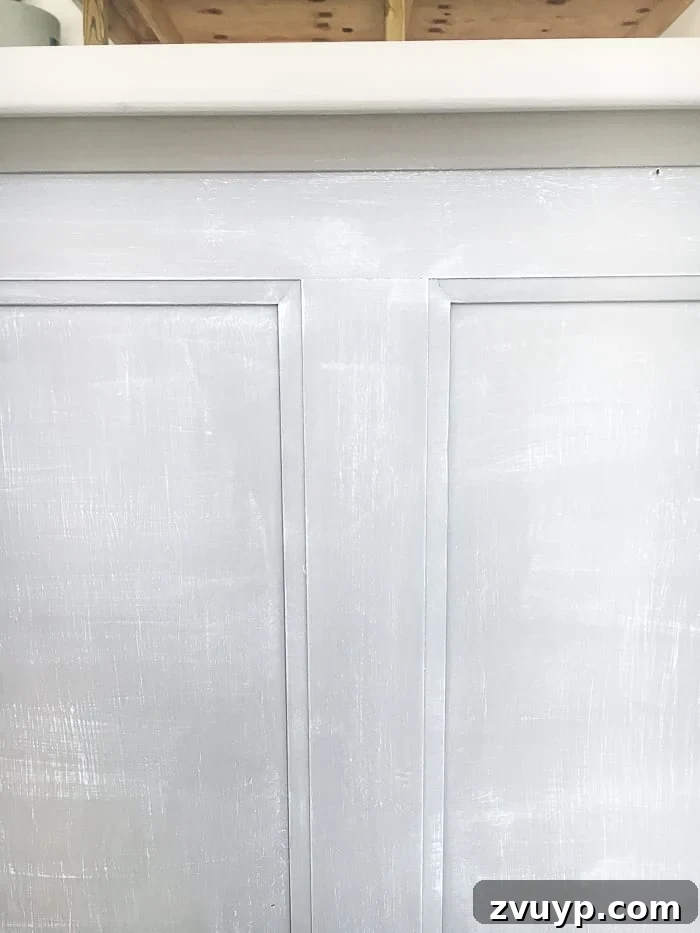 From Weathered to Wonderful A Painted Bed Revival 6 Close-up of the subtle dry-brushed texture on the bed, showcasing the layered paint effect for an authentic weathered finish.