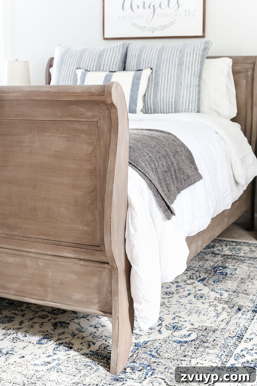 From Weathered to Wonderful A Painted Bed Revival 9 Detailed shot of the painted weathered wood bed, highlighting its unique charm and character in the guest bedroom setting.