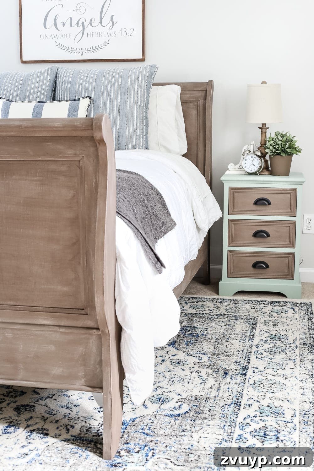 From Weathered to Wonderful A Painted Bed Revival 10 The newly painted weathered wood bed complements the two-tone nightstands, creating a cohesive yet varied aesthetic in the guest room.