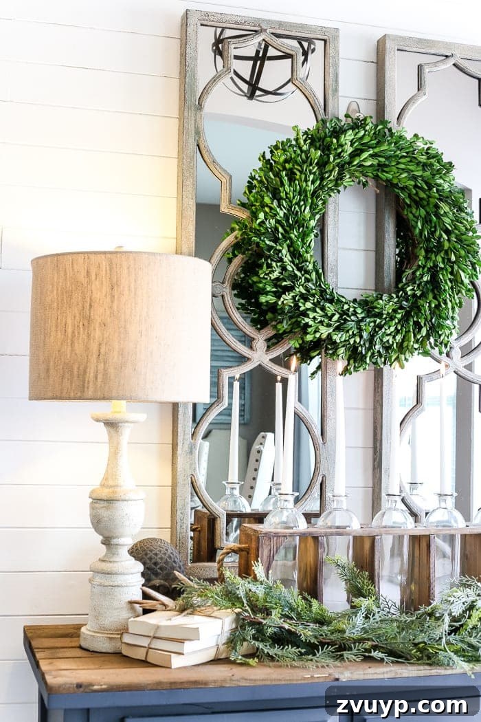 Transform Your Builder Home with Farmhouse Style 14 A welcoming farmhouse foyer with a vintage-style chandelier, rustic bench, and layered decor, demonstrating thoughtful lighting choices.