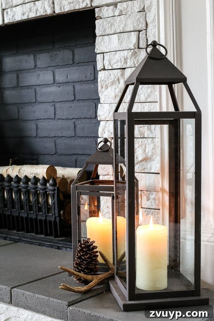 Transform Your Builder Home with Farmhouse Style 15 A cozy farmhouse living room featuring soft lighting from lamps and a chandelier, complementing a brick fireplace and neutral furnishings.