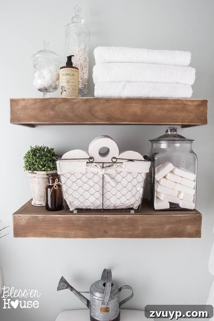 Transform Your Builder Home with Farmhouse Style 21 A farmhouse bathroom with a mix of textures including a wooden vanity, metal fixtures, glass jars, and natural fabrics, creating a cozy atmosphere.