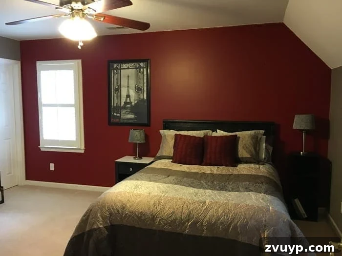 Dark and dated guest bedroom before its cottage style makeover, featuring heavy colors and outdated decor.