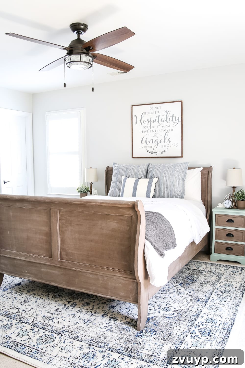 After: Serene blue cottage style guest bedroom makeover with transformed Craigslist furniture and budget decor.