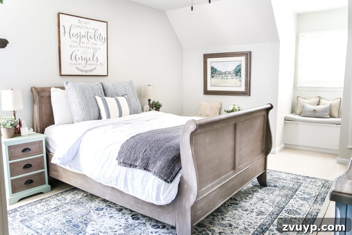 After: Brightened corner of the guest bedroom with a painted bed, blue accents, and refreshed decor.