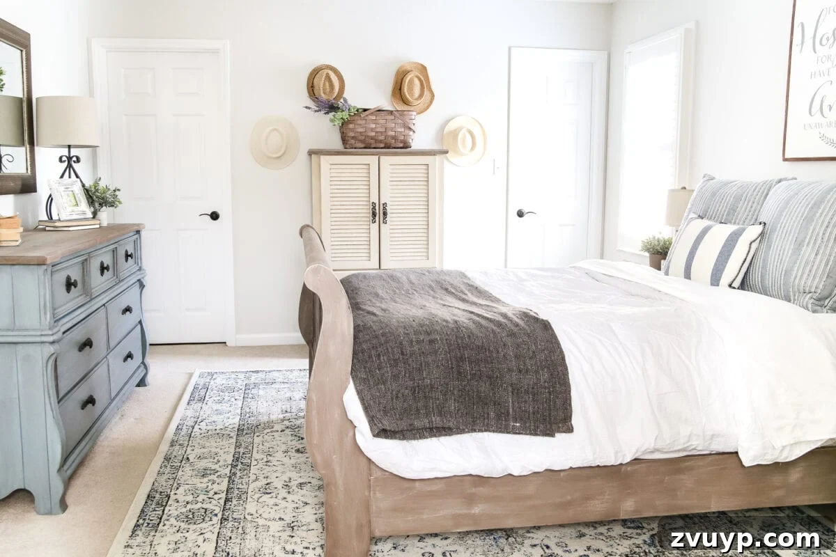 After: Inviting view of the guest bedroom, highlighting the blue dresser and curated decor.