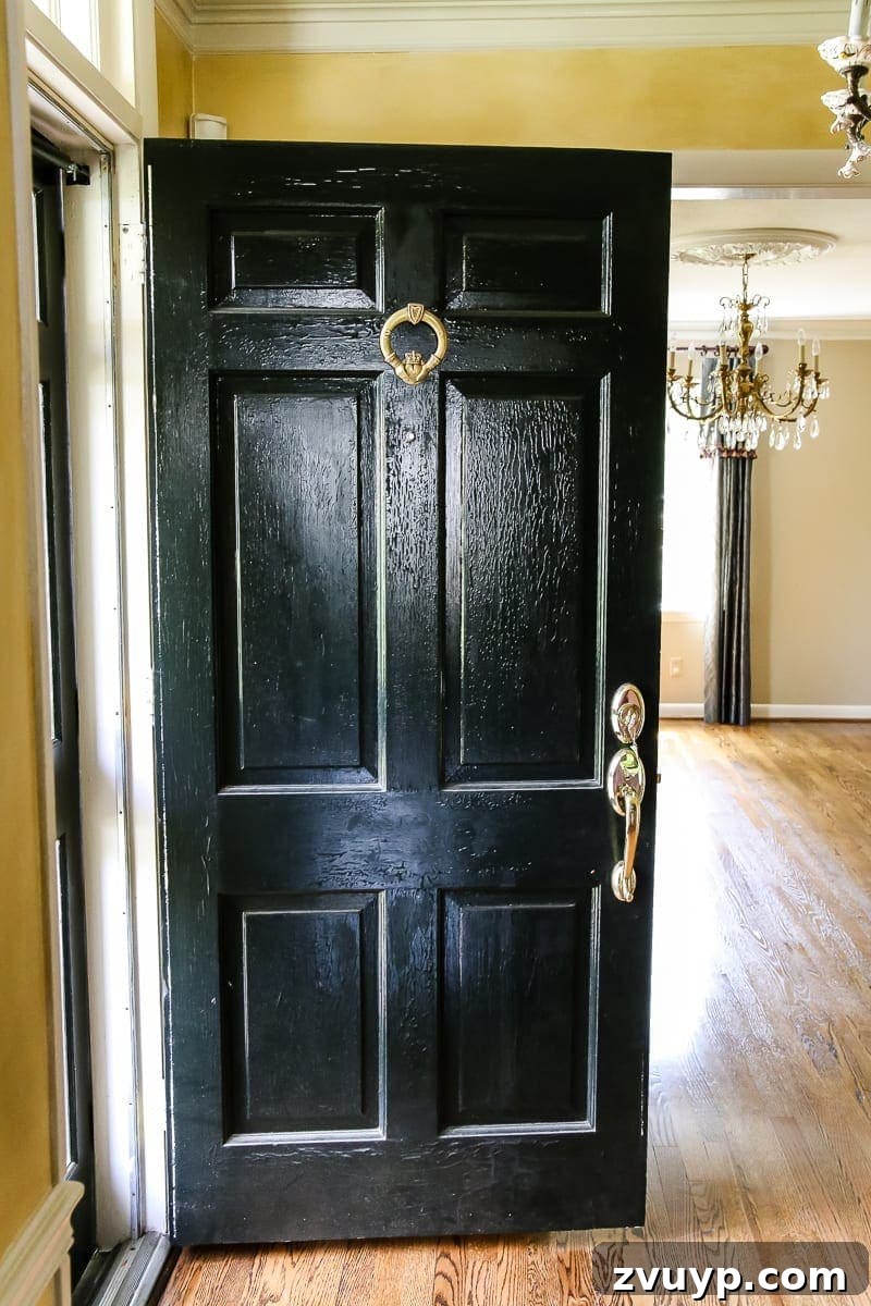 Our New Home: The Unfurnished Tour 4 Elegant foyer with exquisite crown molding, a decorative ceiling medallion, and gleaming hardwood floors.