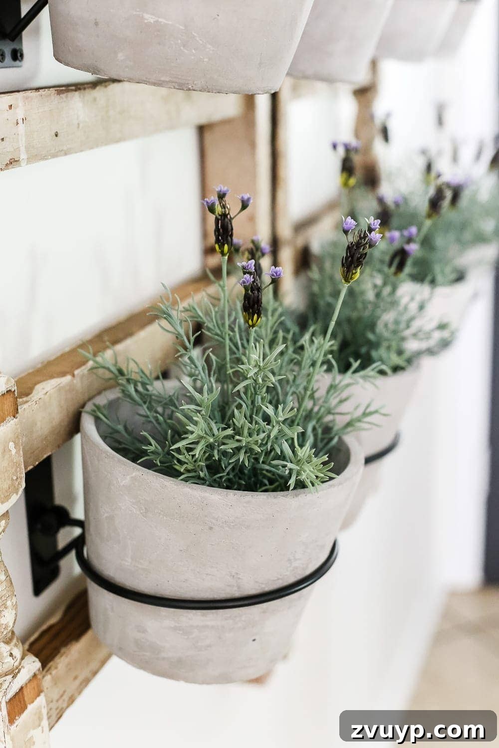 Heirloom Railing Wall Garden 6 DIY Antique Banister Wall Planter | www.blesserhouse.com - A quick and simple tutorial for how to make a wall planter from a repurposed antique banister using artificial plants. Cute way to bring the outdoors in!
