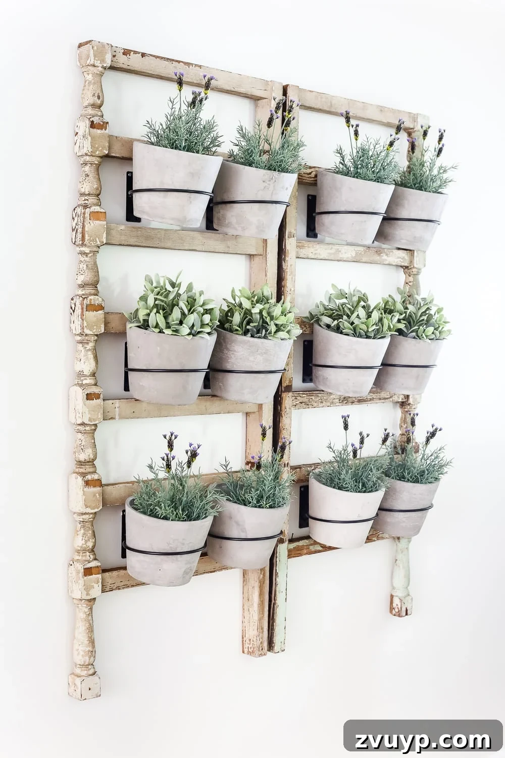 Heirloom Railing Wall Garden 7 DIY Antique Banister Wall Planter | www.blesserhouse.com - A quick and simple tutorial for how to make a wall planter from a repurposed antique banister using artificial plants. Cute way to bring the outdoors in!